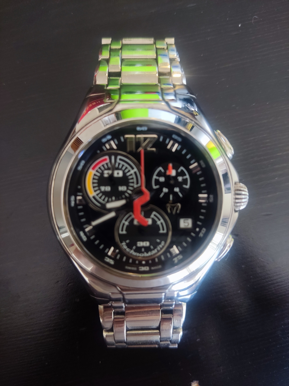 Stainless Steel Chronograph Watch with Black Dial and Red Accents